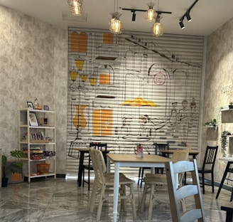 A warm and inviting workspace with natural elements and colorful artistic illustrations adorning the walls.