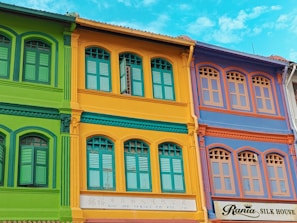 Before and after view of a renovated facade showing clean and vibrant surfaces