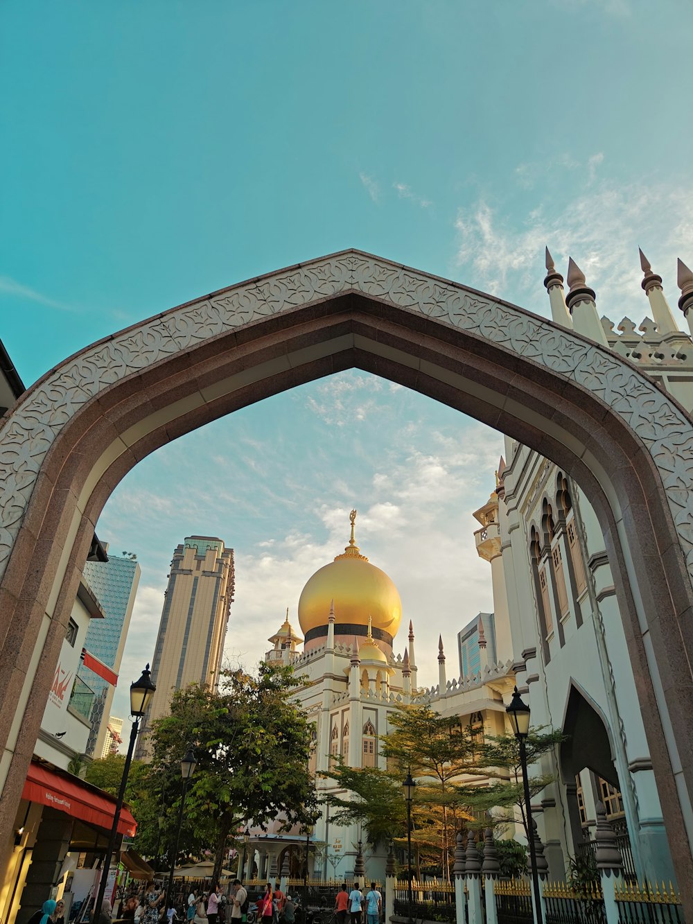 a large white building with a gold dome