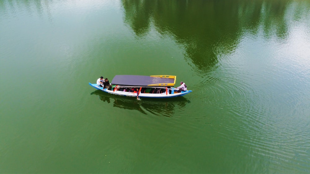 a small boat floating on top of a lake