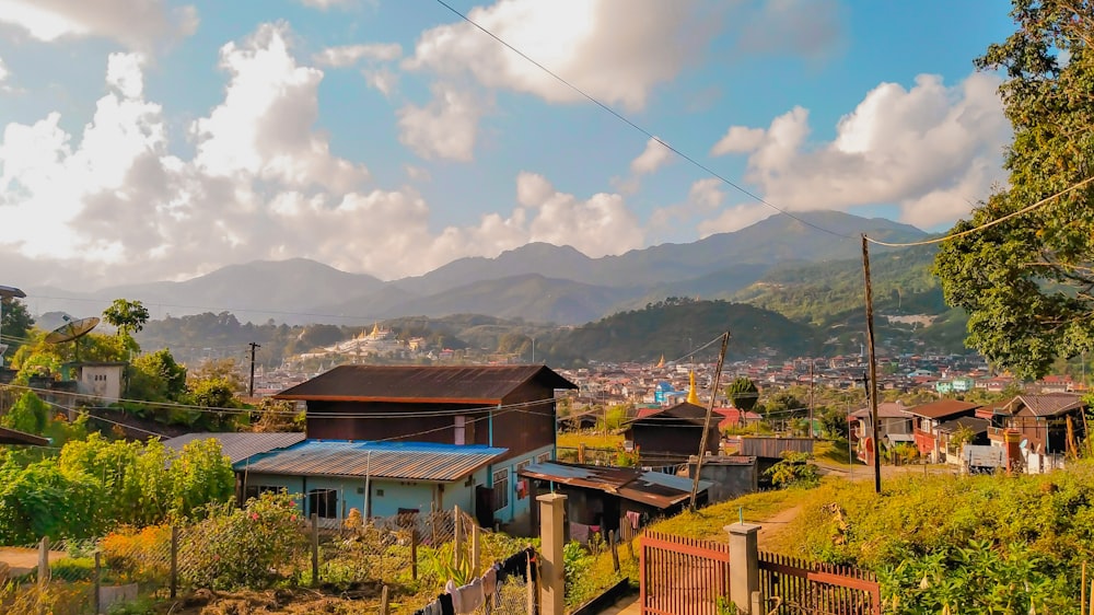 a small village with mountains in the background