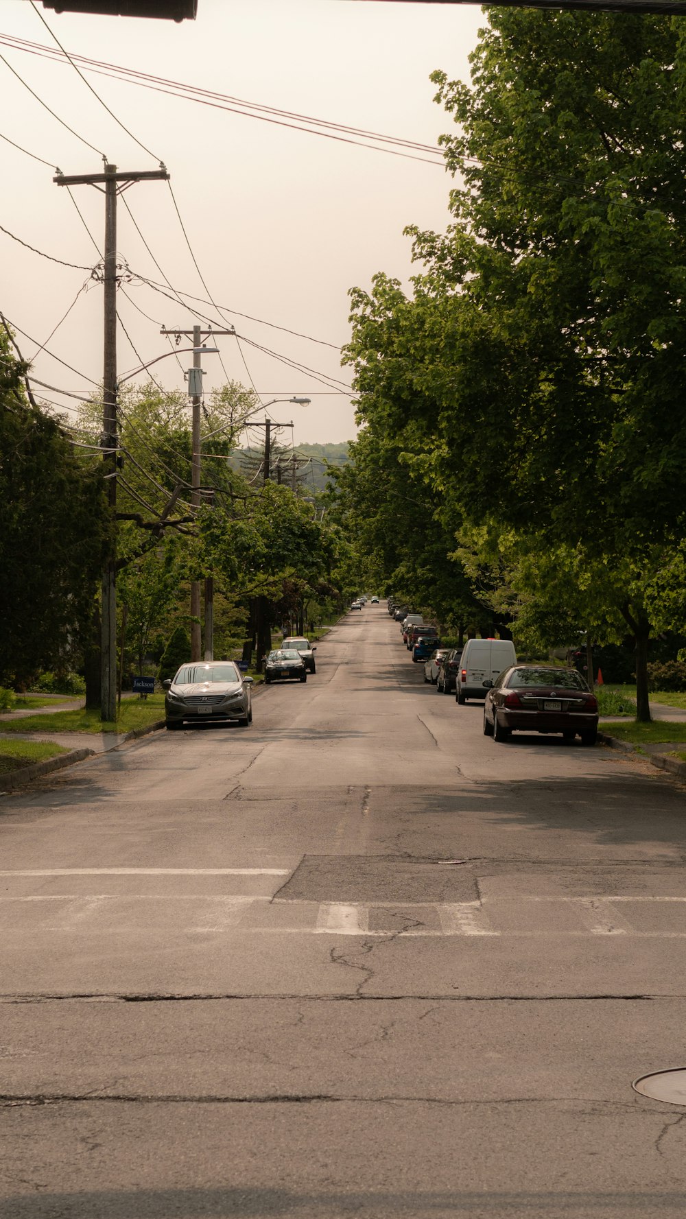 a street with cars parked on the side of it