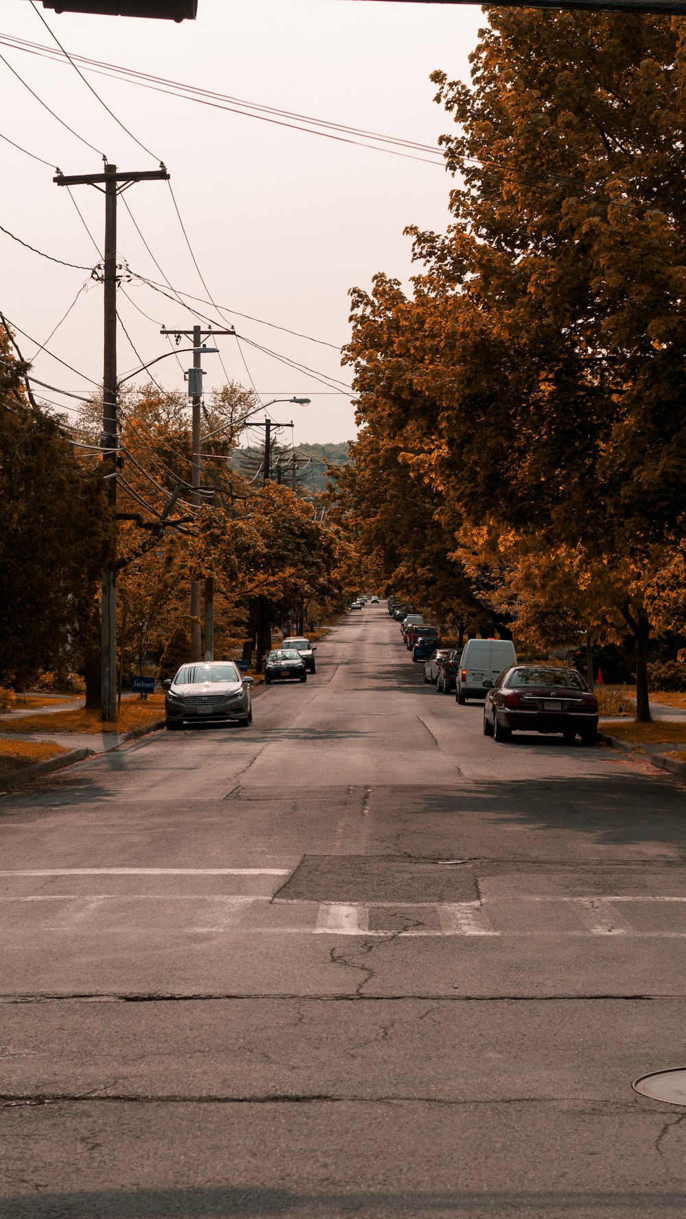 a street with cars parked on the side of it