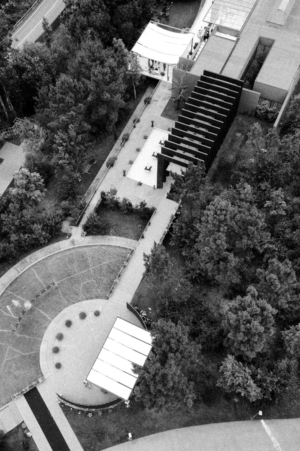 an aerial view of a building and a park