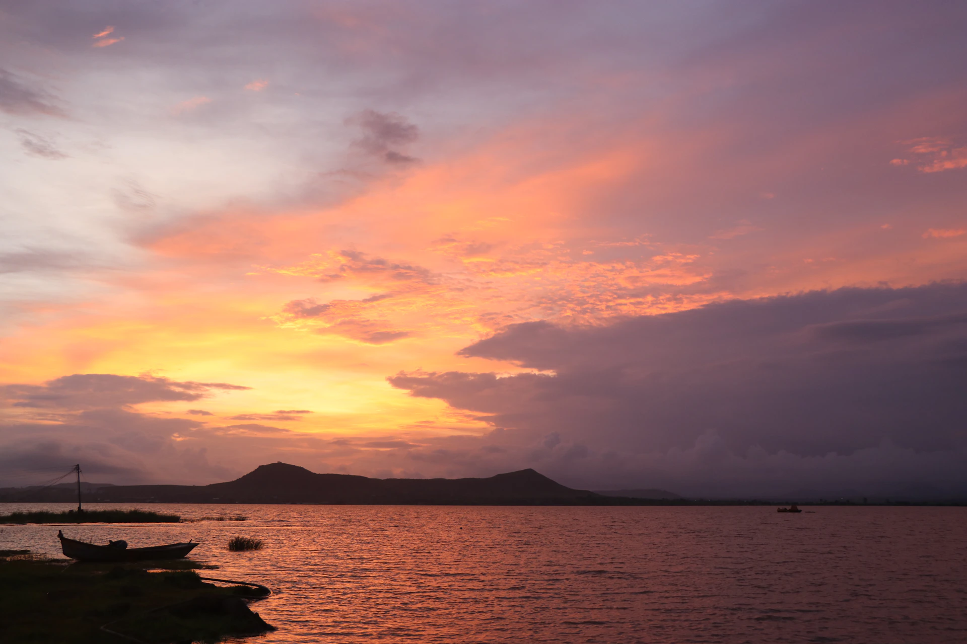 woman wearing yellow long-sleeved dress under white clouds and blue sky during daytime