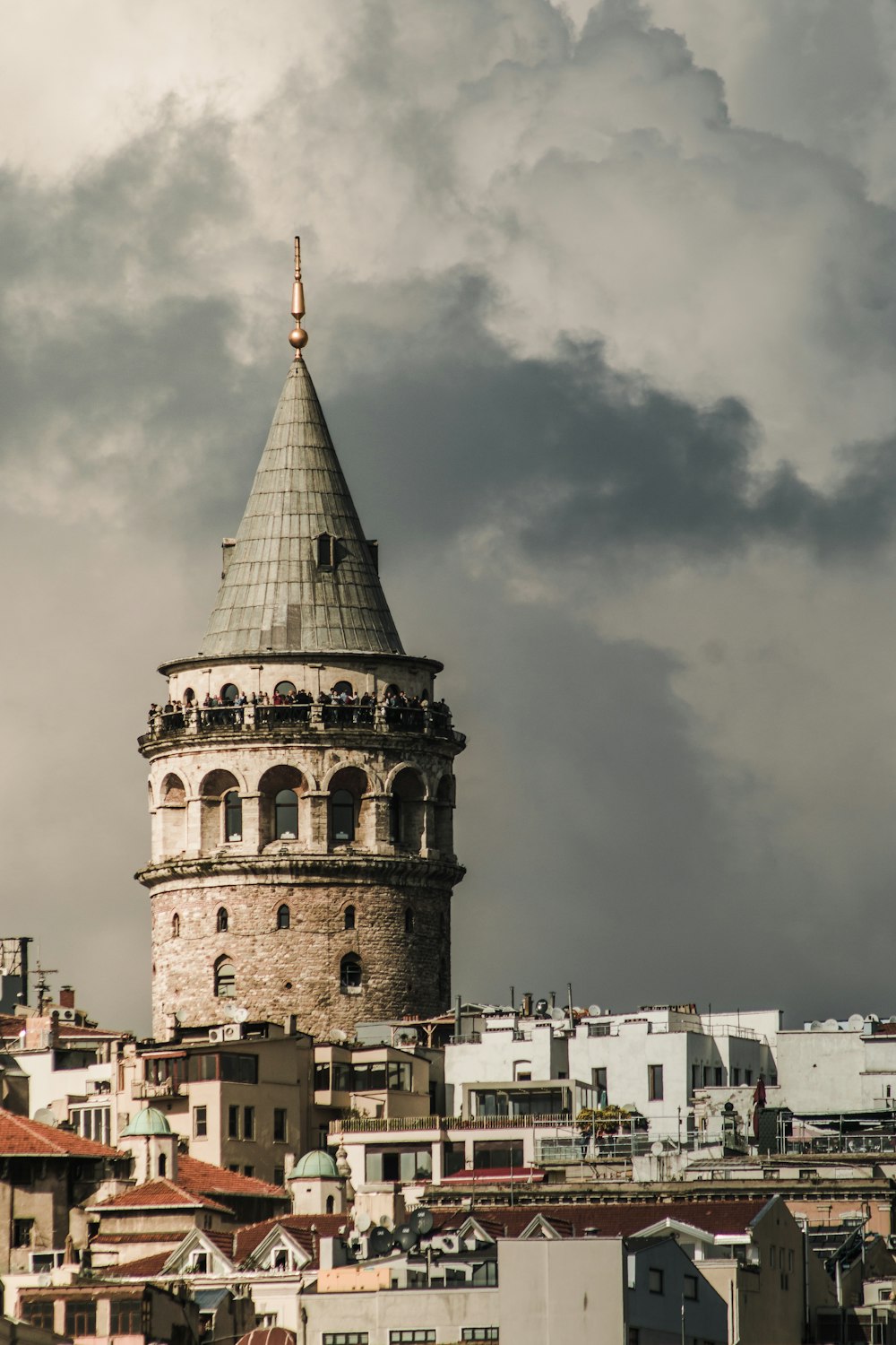 a very tall tower with a clock on it's side