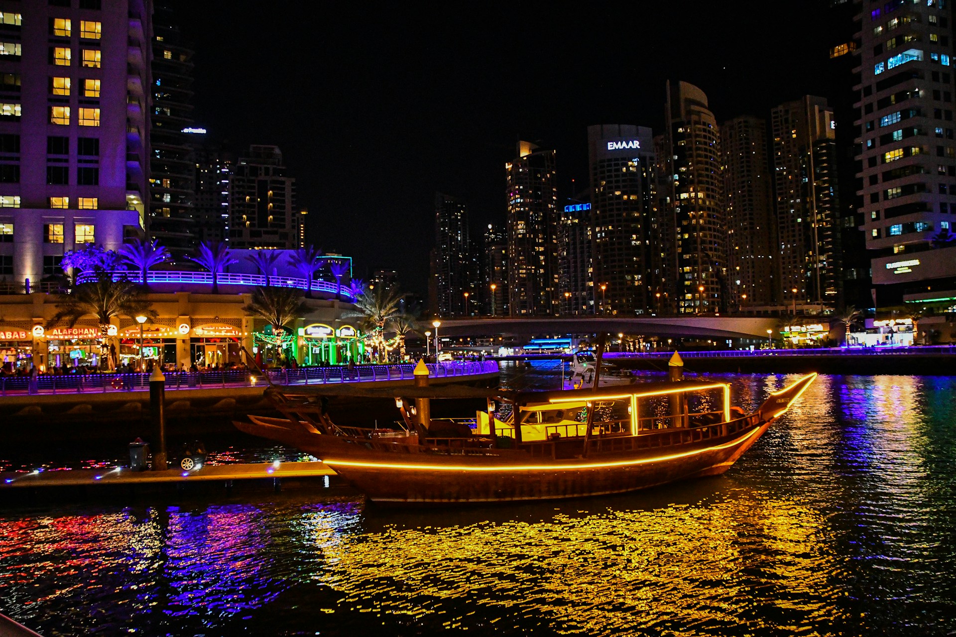 woman wearing yellow long-sleeved dress under white clouds and blue sky during daytime