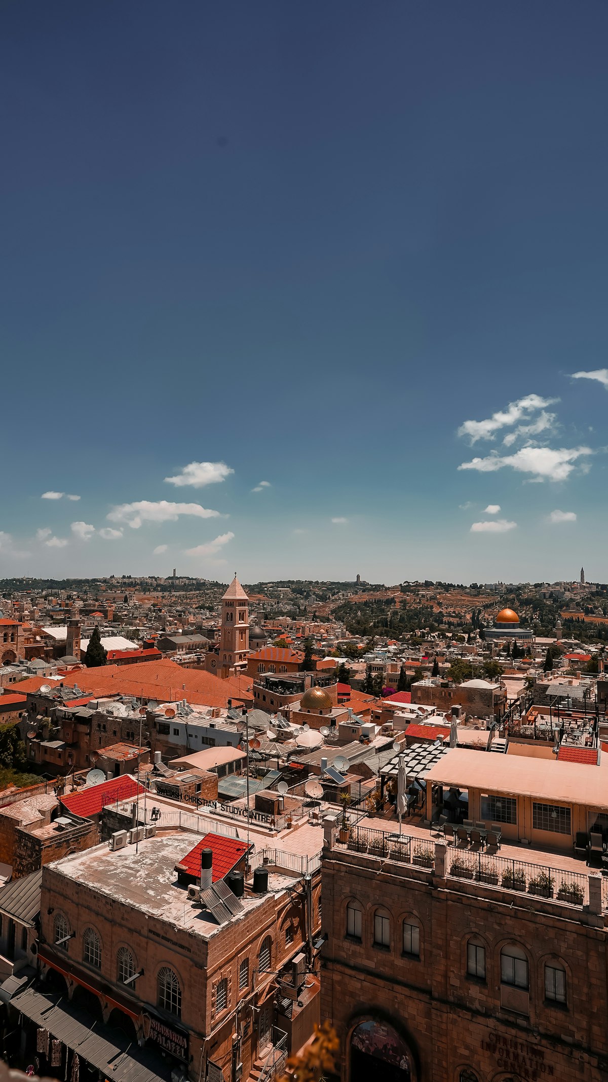 Jerusalem August — the rooftops of the Old City and Dome of the Rock under intense summer sun
