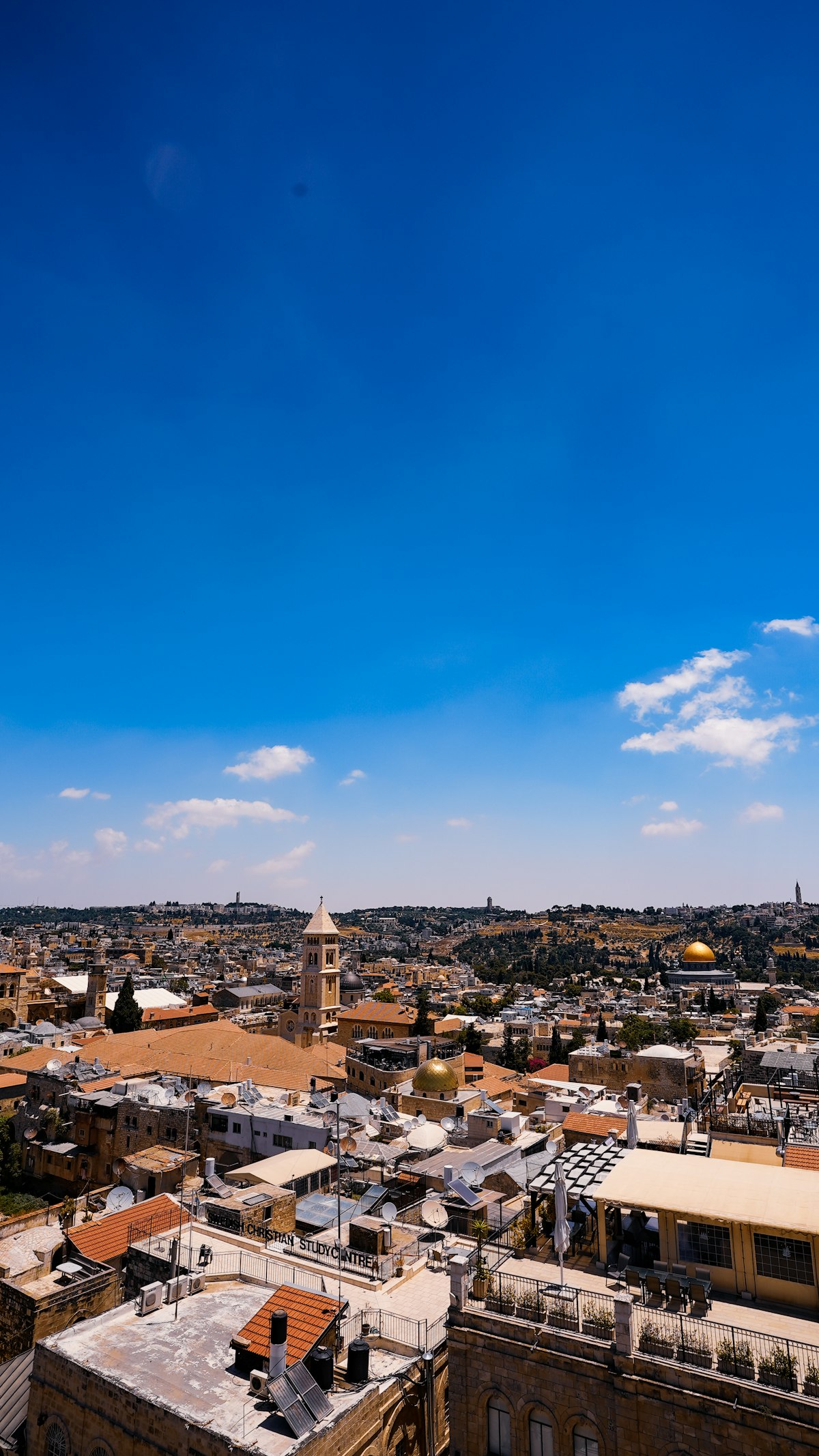 Jerusalem September — a wide aerial view of the Old City in warm dry autumn light