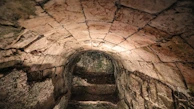 An atmospheric map of a medieval dungeon with intricate corridors and chambers.