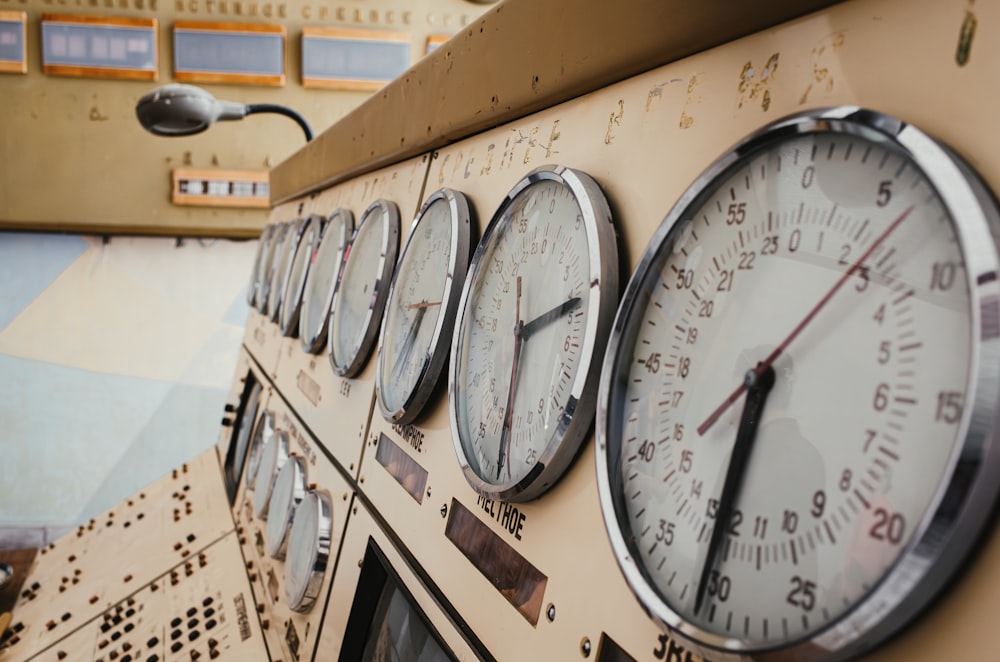 a close up of a bunch of clocks on a wall