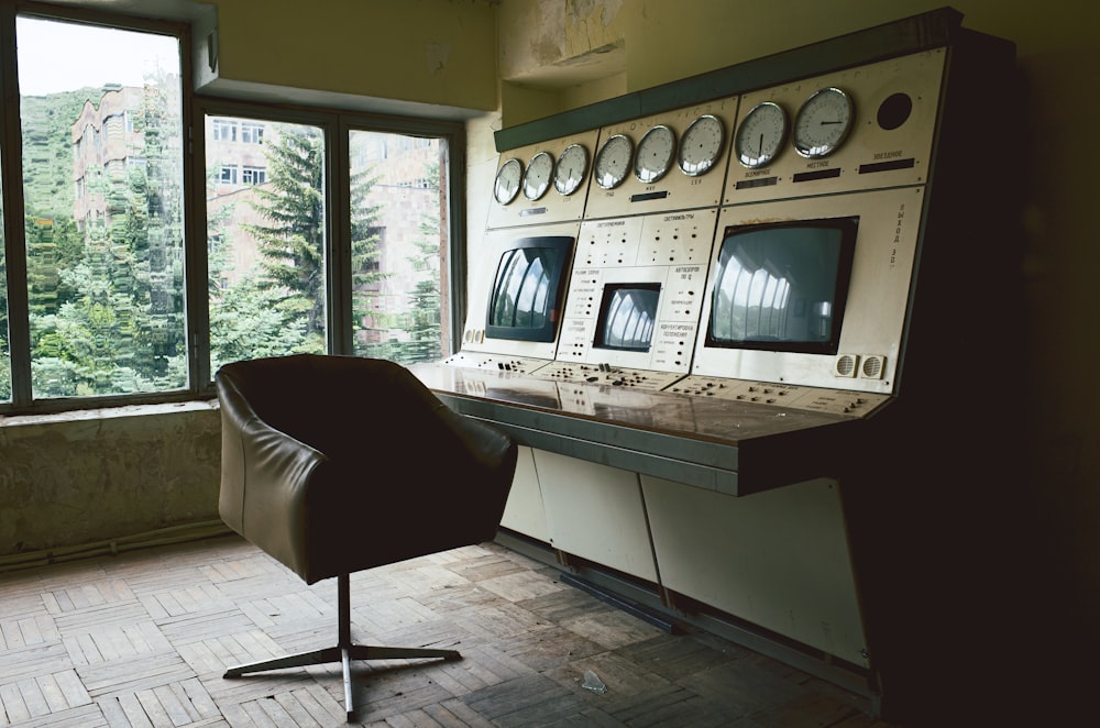 a chair sitting in front of a computer monitor