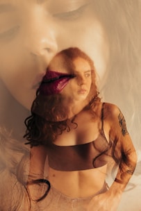 a woman's face is reflected in a mirror