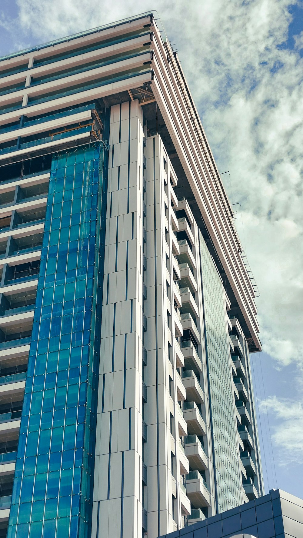 a very tall building with a sky background