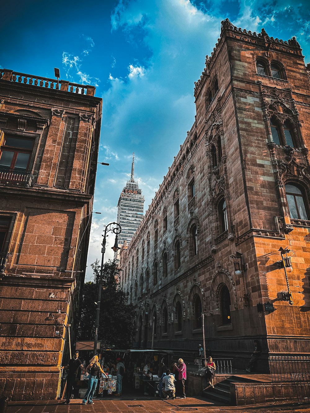 a group of people standing in front of a tall building