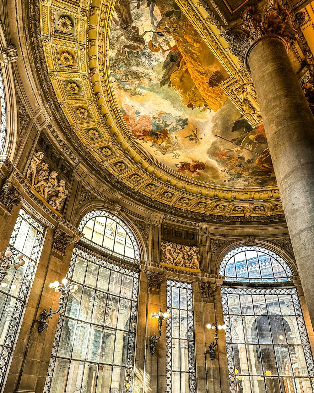 a domed room with a painting on the ceiling