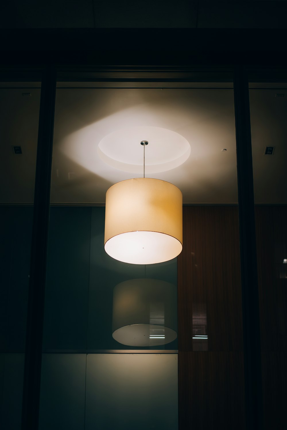 a lamp hanging from a ceiling in a room