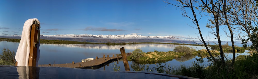 a body of water with mountains in the background