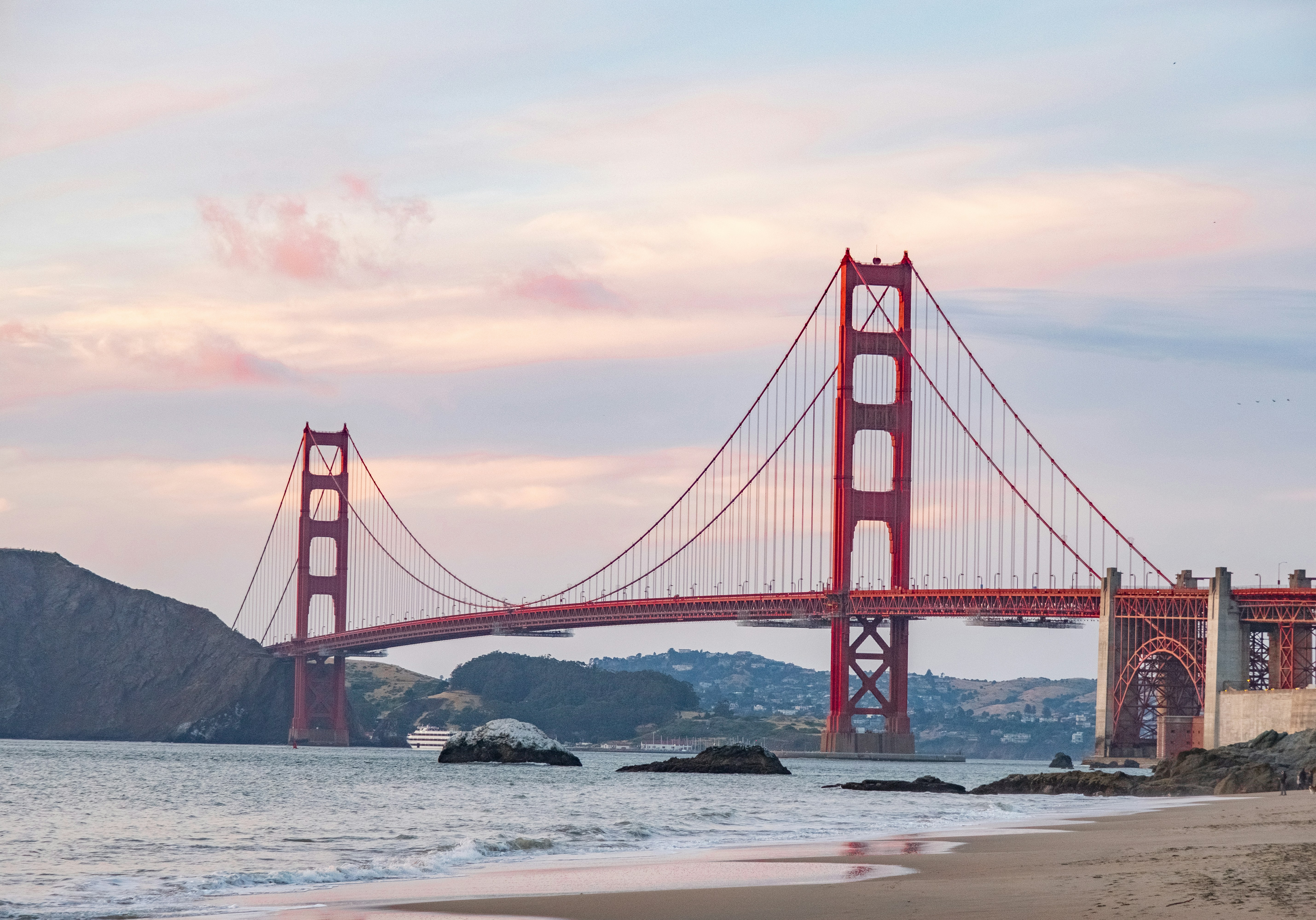a large bridge spanning over a body of water, Golden Gate Bridge as seen from Baker