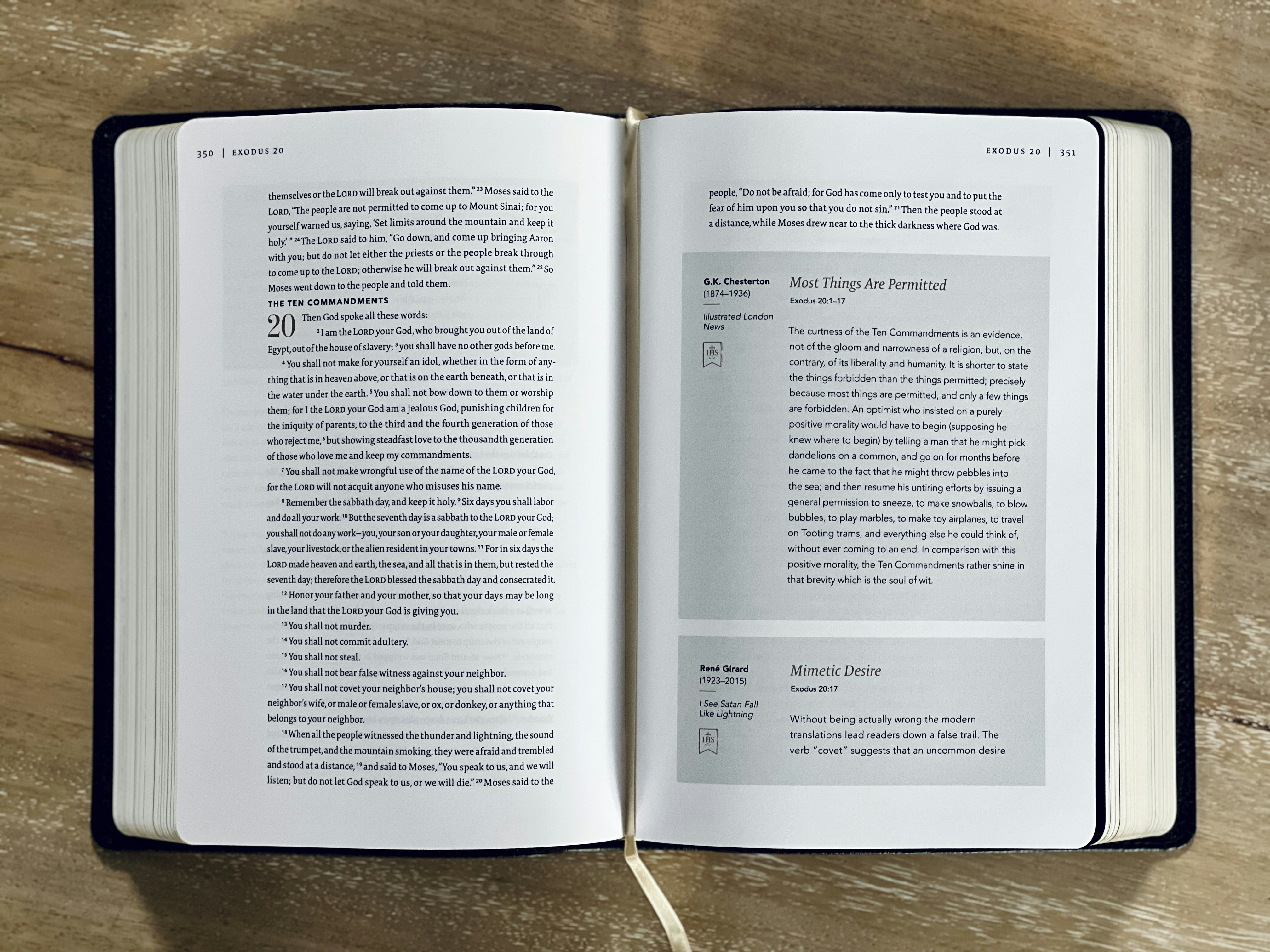 an open book sitting on top of a wooden table