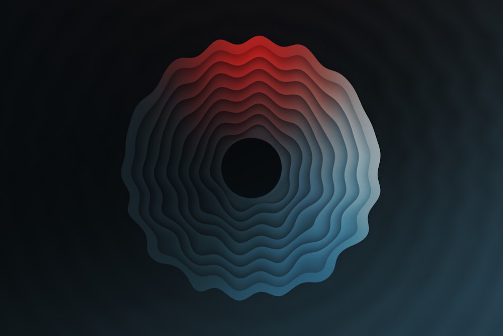 a black background with red and blue shapes