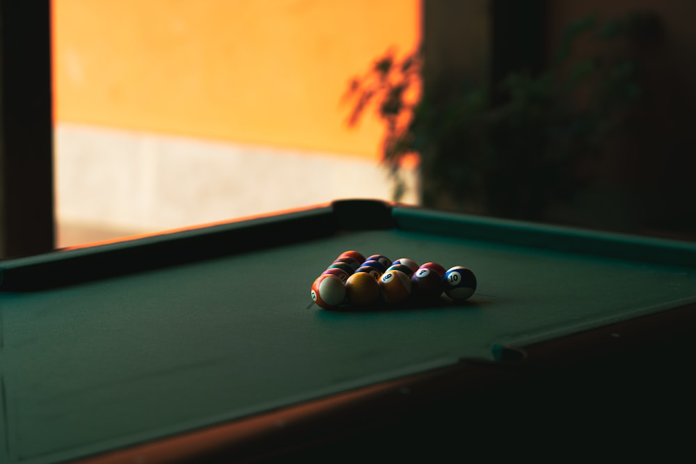 a pool table with three pool balls on it