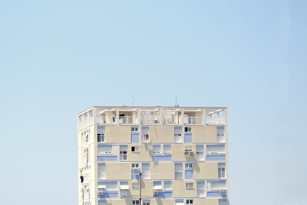 a tall building with balconies on top of it