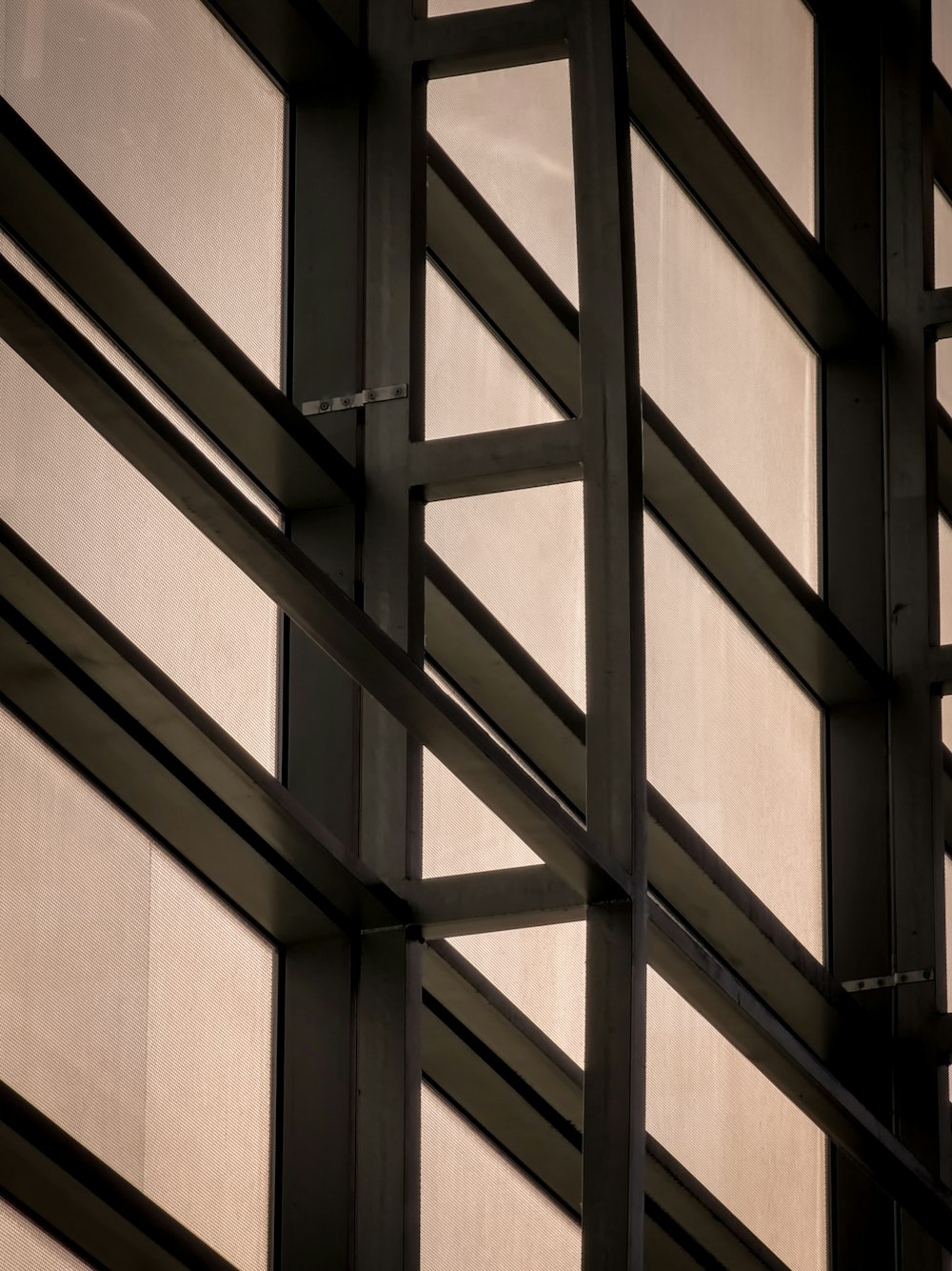 a close up of a metal structure with a clock on it