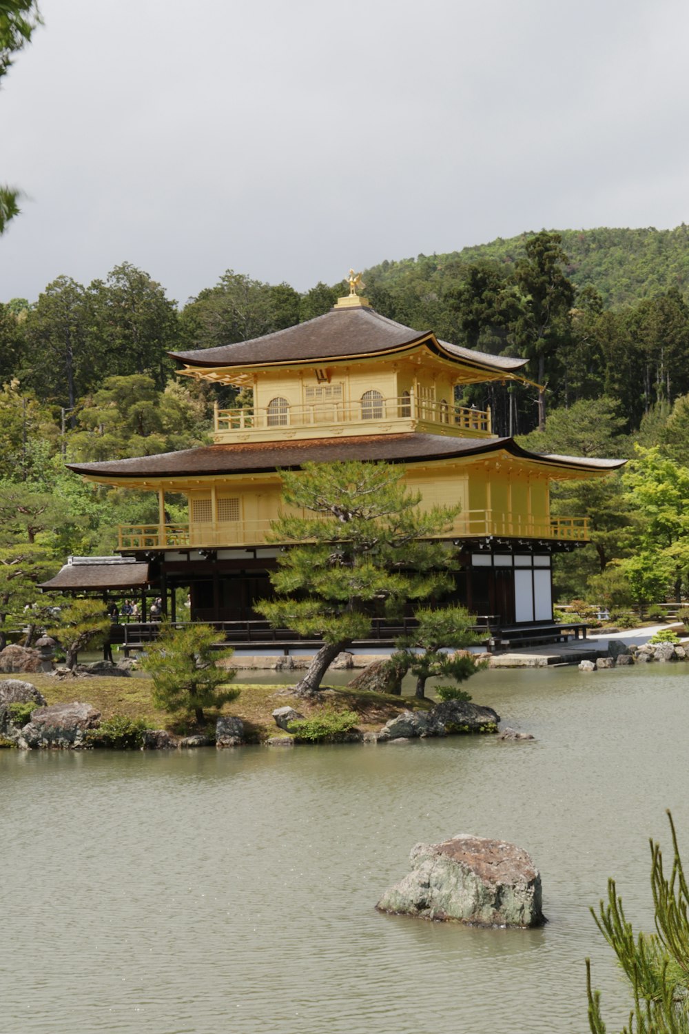 a large yellow building sitting on top of a lake
