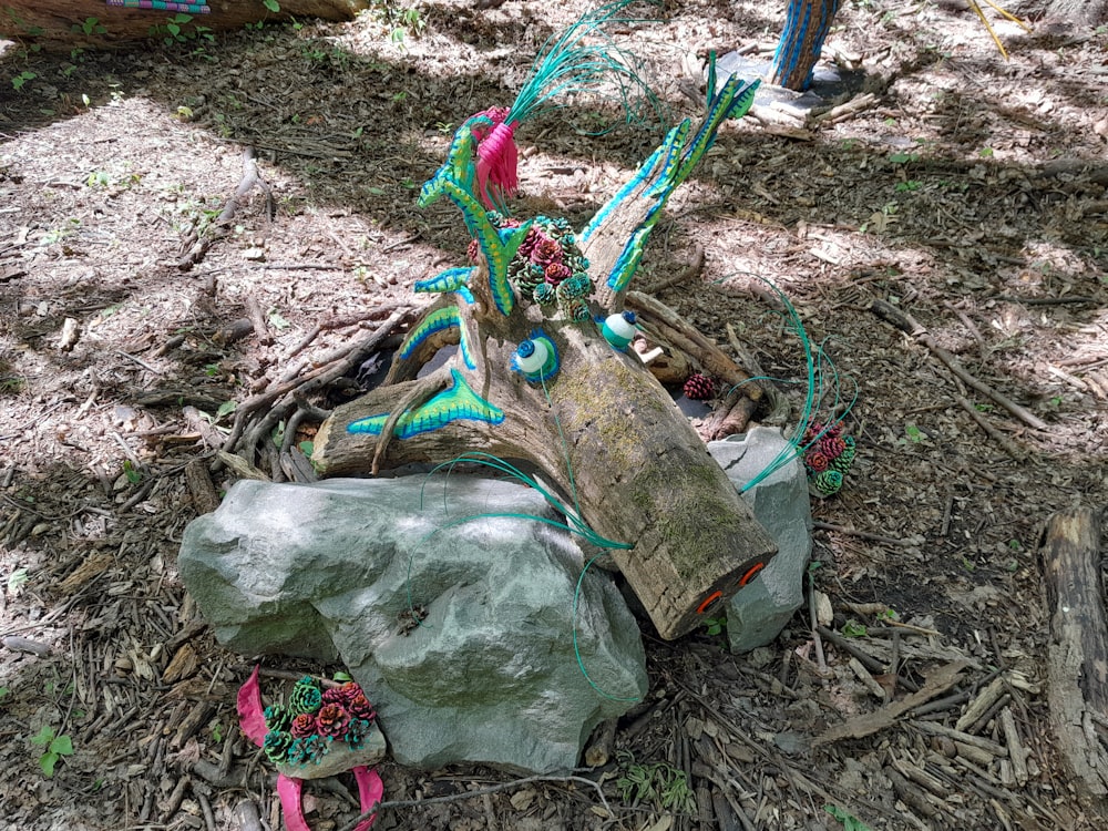 a statue of a bird sitting on top of a rock