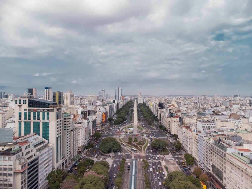 an aerial view of a city with tall buildings