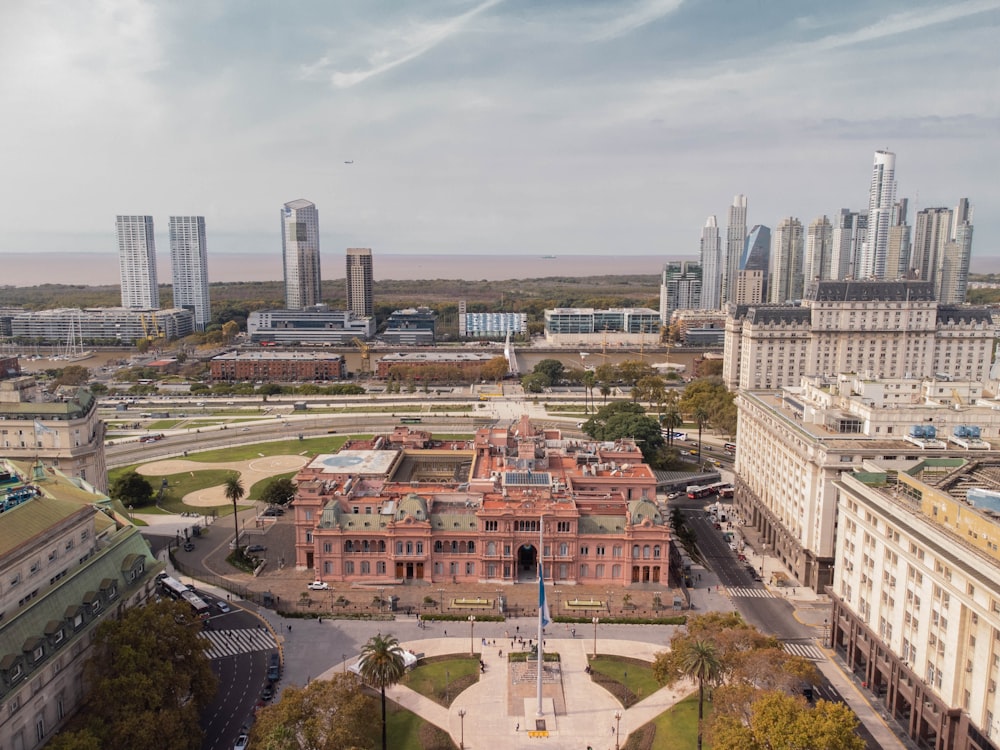 an aerial view of a city with tall buildings