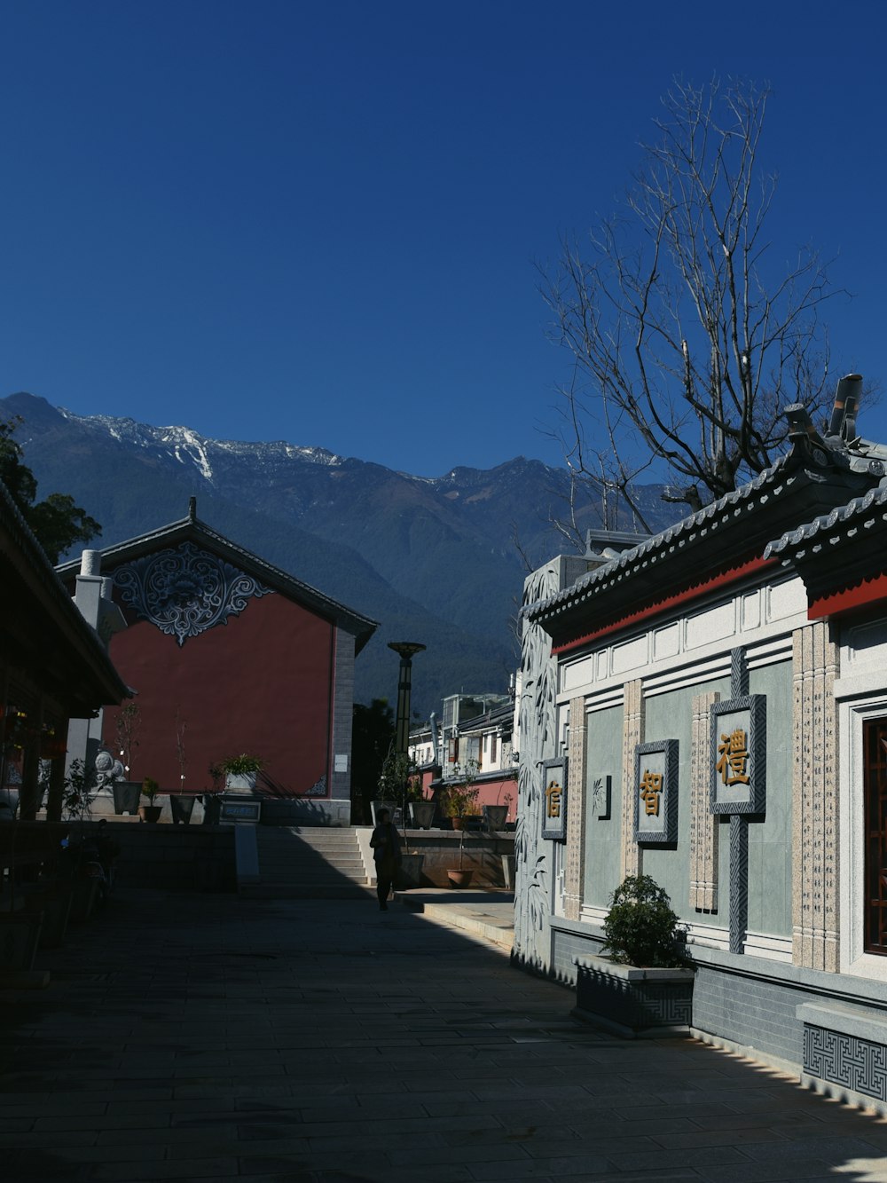 a building with a mountain in the background