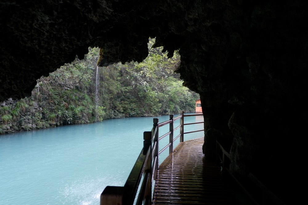 a view of a body of water from inside a cave