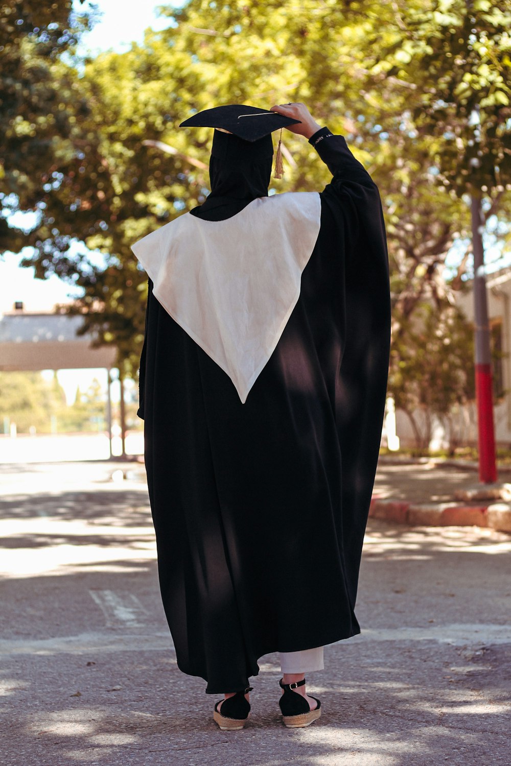a person dressed in a black and white robe