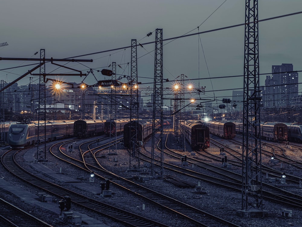 a train station with several trains on the tracks