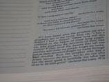 A close-up view of a book page featuring a passage in English. The text includes biblical references, with some parts in bold and the word 'LORD' prominently displayed multiple times. The layout includes line numbers on the left and the text is formatted in a serif font.