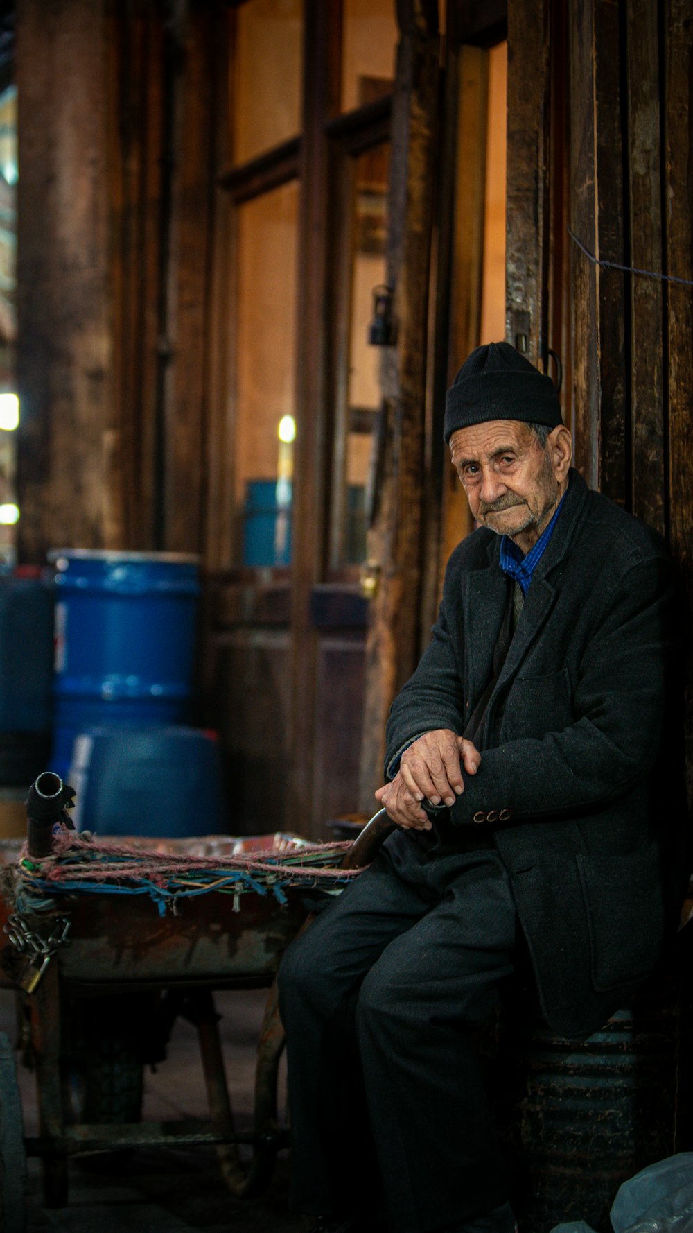 a man sitting on a table with a knife in his hand