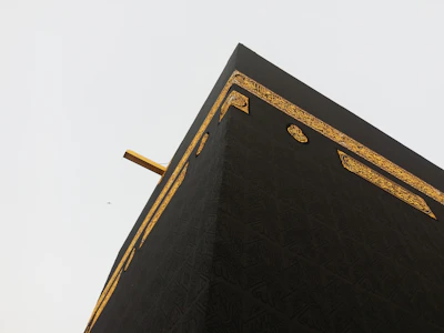 Slow-motion view of Ka'bah with soft golden light at dawn