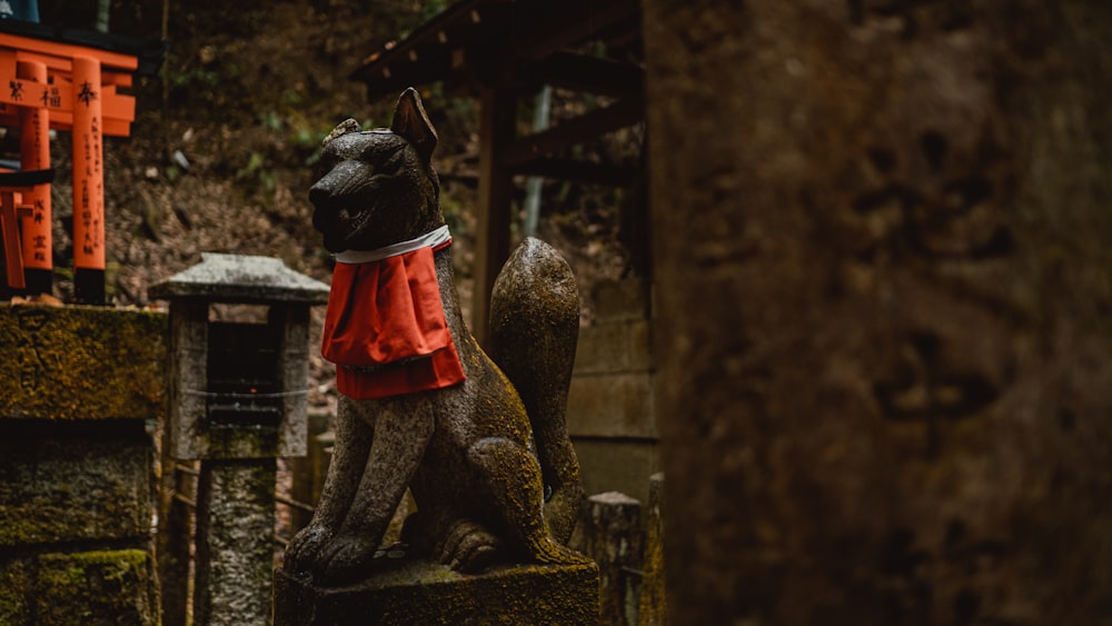 a statue of a dog wearing a red scarf