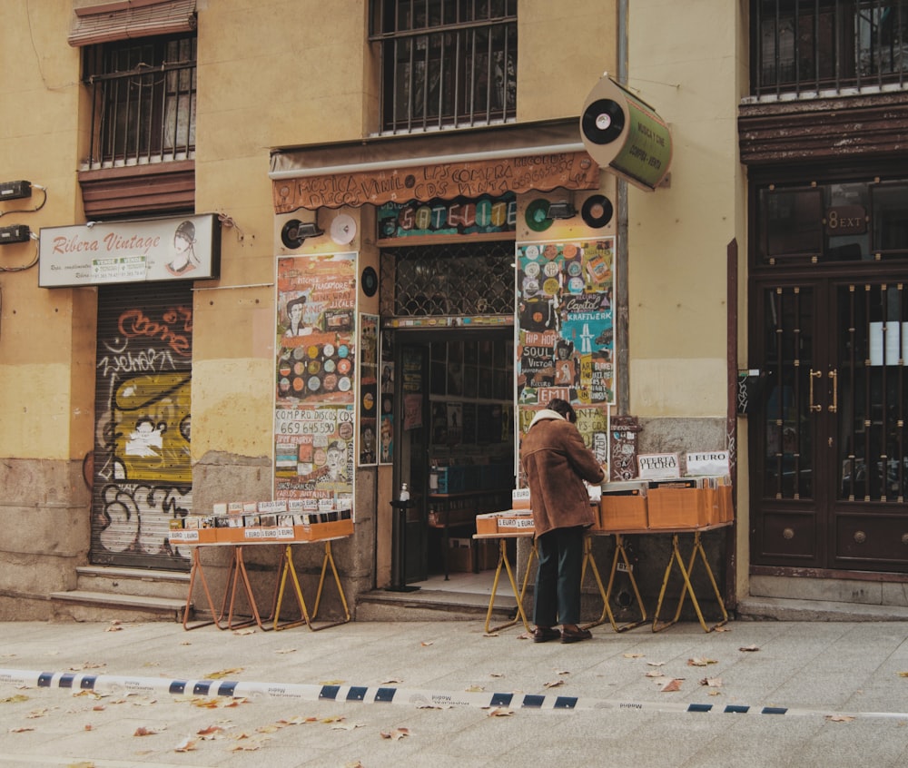 a man standing in front of a store