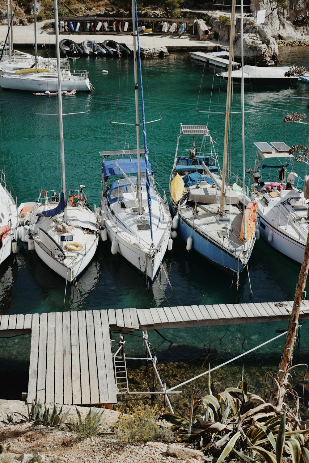 a group of boats docked at a dock