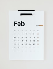 A minimalist calendar page marked with a bold, hopeful date circled in red.