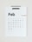 A minimalist wall calendar displays the month of February 2023, with days of the week arranged in a grid. The numbers are printed in black except for the Sundays, which are in brown.