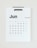 A minimalistic wall calendar displaying the month of June 2023. The calendar has a clean design with bold black typography for the days of the week and numbers. Sundays are highlighted in light brown, while the rest of the days are in black.