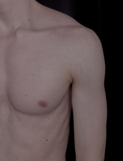 a close up of a man with no shirt on