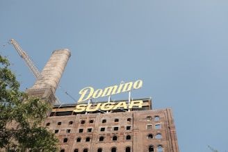 a tall building with a sign on top of it