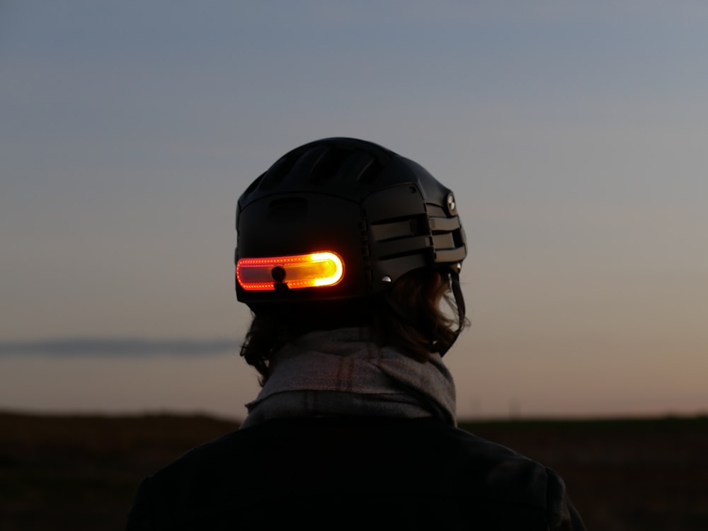 a person wearing a helmet with a light on it