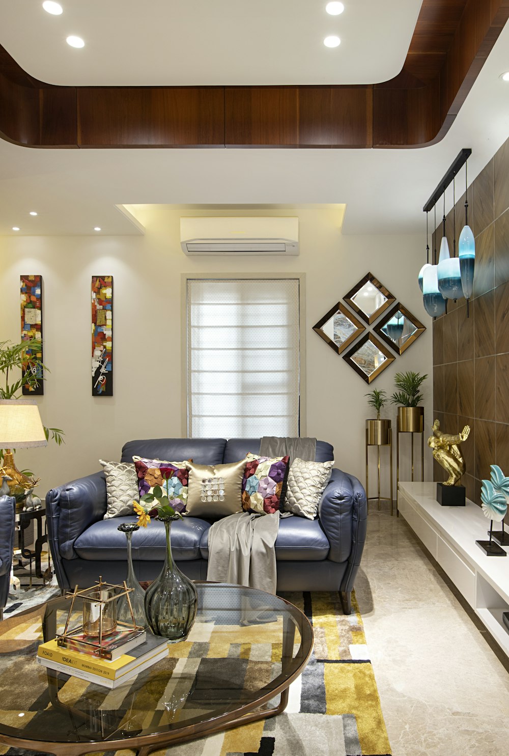 a living room with a blue couch and a coffee table