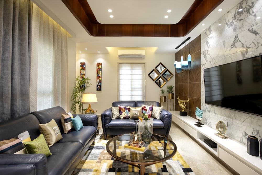 a living room filled with furniture and a flat screen tv